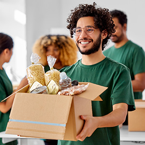Volunteer holding food donation box