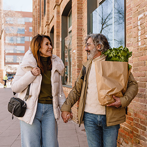 Walking together while carrying grocery bags