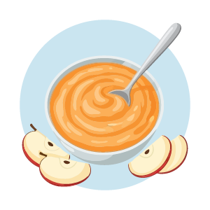 Bowl of smooth applesauce with sliced apples