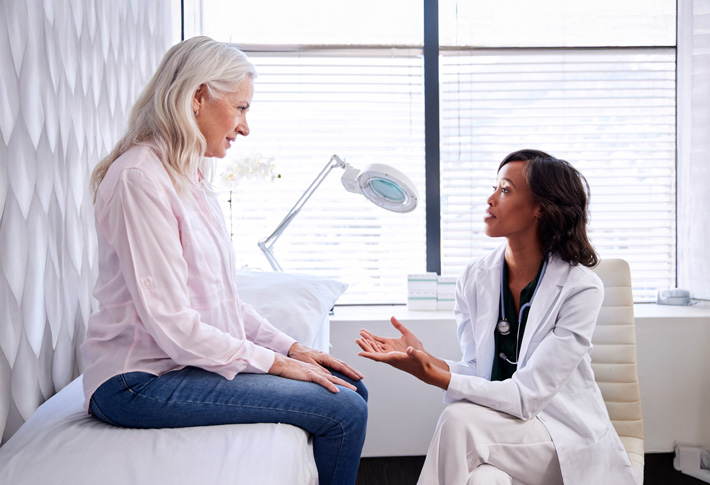 Doctor discussing health concerns with patient in clinic